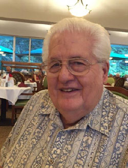 Rev. Elden Buck in a large dining room