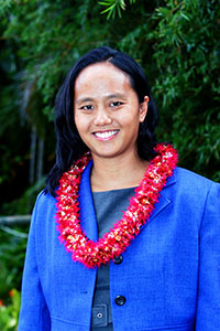 Representative Della Au Belatti, outdoors with lei